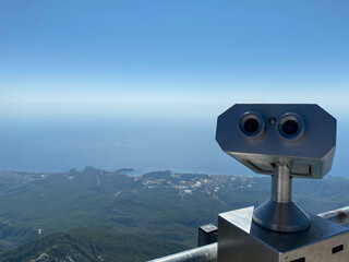 Binoculars telescope on observation deck for tourist in Lindau. Coin operated tourist binoculars
