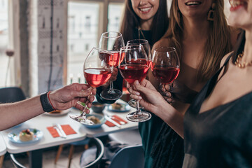 Group of friends celebrating in the bar.