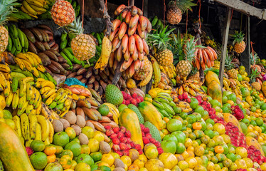 Shelf of many fresh fruits, fresh fruit stall, concept of fruits and healthy food, sale of various fruits