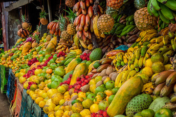 Shelf of many fresh fruits, fresh fruit stall, concept of fruits and healthy food, sale of various fruits