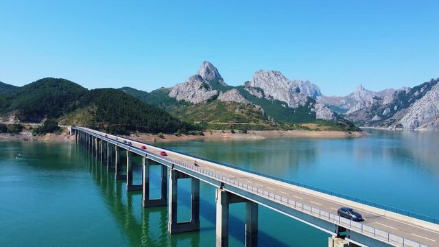 Drone View of the Bridge Ria&ntilde;o in the foreground and the background mountains.