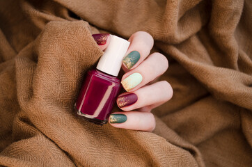 Beautiful matte muted color nails close-up, glittery nail art manicure.