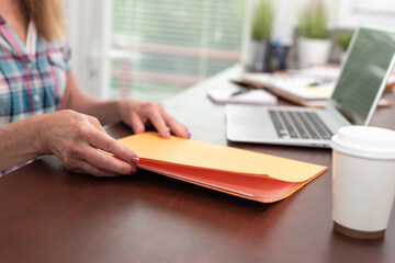 Fototapeta premium Businesswoman holding folder