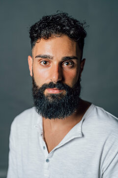 Young Man With Black Beard In Studio