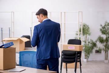 Young male employee in relocation concept