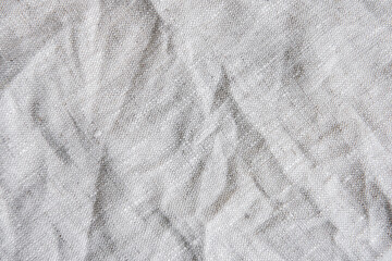 Fototapeta na wymiar Gray textile linen tablecloth in full frame.