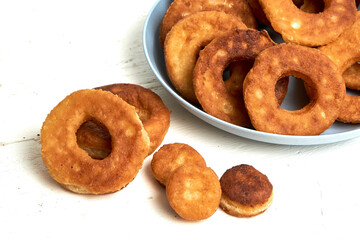 Fried curd donuts in a blue plate