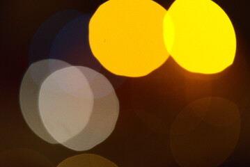 Three large circles of bokeh on a dark background