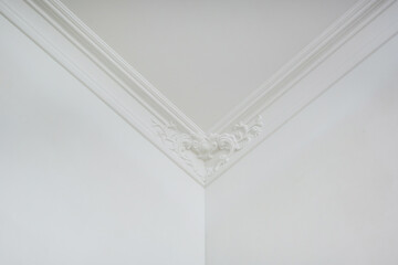 Detail of corner ceiling cornice with intricate crown molding.