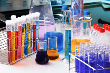 workbench with Test tubes in Research laboratory for development of experiments. Work table of chemistry lab with glassware and measurement