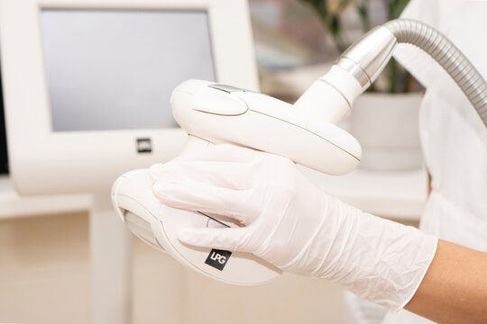 Close up of vacuum roller massage apparatus nobody on medical background. Endermologie is the only FDA-approved and non-invasive method designed to reduce the appearance of cellulite
