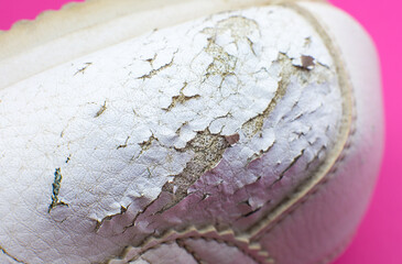 Close up Torn white leather sneakers. Leather shoes. Shoe repair concept.