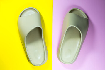 Beige Summer Slippers on the colorful background. Pair of house indoors shoes.