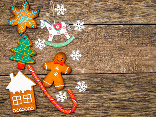 Gingerbread cookies over wooden background