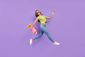 Full length body size view of nice trendy cheerful girl jumping listening song having fun going isolated over purple violet color background