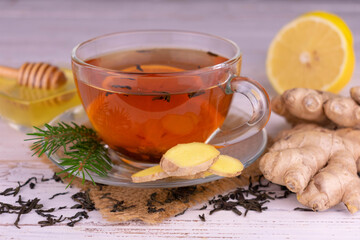 Tea with honey, lemon and ginger. Close-up.