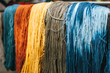 Full frame shot of colorful dyed yarn background. Colourful of dyed silk cotton from the natural...