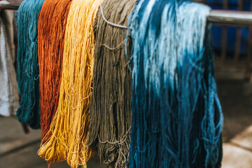 Full frame shot of colorful dyed yarn background. Colourful of dyed silk cotton from the natural...