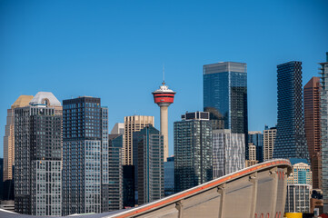 View of the Calgary Tower with modern skyscrapers under the blue sky,  Alberta, Canada