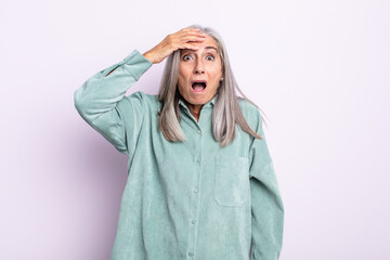 middle age gray hair woman panicking over a forgotten deadline, feeling stressed, having to cover...
