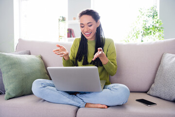 Fototapeta premium Full body photo of young happy woman sit sofa talk camera laptop inside house home indoors