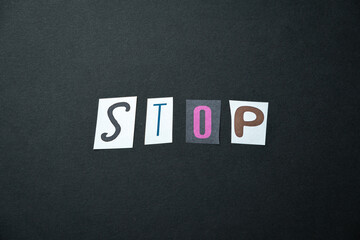 Stop words. Caption, heading made of letters with different fonts on a dark background.