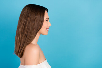 Profile photo of cute brunette young lady look empty space wear white top isolated on blue color background