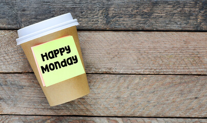 HAPPY MONDAY words on the kway mug and wooden table.