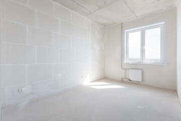 interior of the apartment without decoration in gray colors