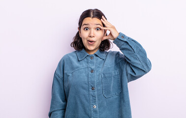 pretty teenager woman looking happy, astonished and surprised, smiling and realizing amazing and...