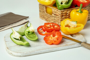 Concept of tasty food with bell pepper on white background