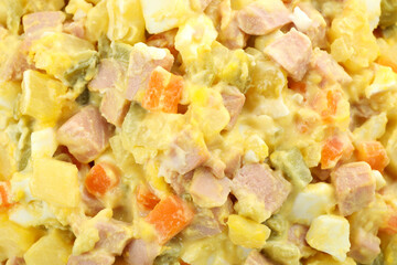 Olivier salad all over background, close up
