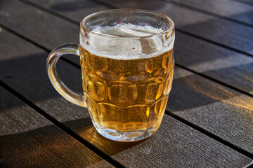 Mug of beer on a wooden table