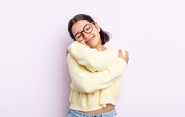 pretty teenager woman feeling in love, smiling, cuddling and hugging self, staying single, being...