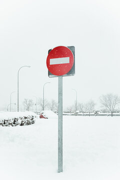 No entry sing in snow near road