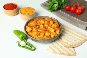 Concept of tasty food with chicken tikka on white background