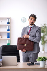 Young male employee working in the office