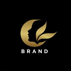 Abstract logo of woman's head in gold color for spa or beauty business