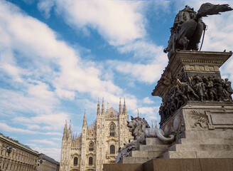 Duomo Square,view of Milan Cathedral  and Vittorio Emanuele II monument early in the morning