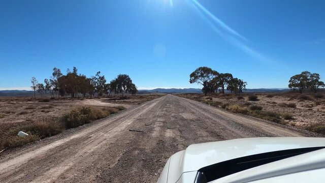 POV White Car Adventure, Road Trip In An Untouched Landscape On A Sunny Day
