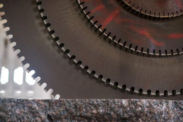Big industrial machine cutting stone in a factory