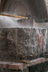 Big industrial machine cutting stone in a factory