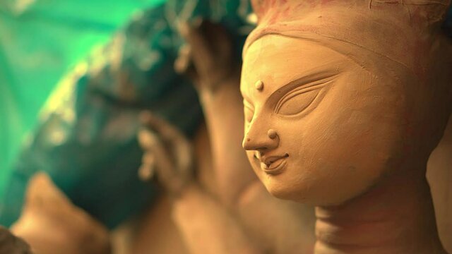 KOLKATA, INDIA - Oct 06, 2021: Photographer captures the bust of Goddess Durga idol before it is painted unfinished Durga idol looks beautiful as it dries in the sun
