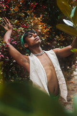 Two Malaysian Indian men surrounded by nature, walking in the grass, laughing together