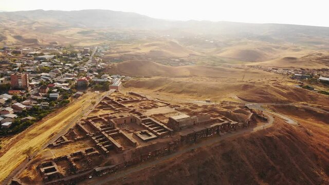 Aerial static view Erebuni fortress ruins on hilltop . Old urartian fortified city . Important historical site in Yerevan, Armenia