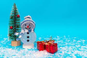 snowman, presents and Christmas tree snow with copy space.new year celebration.