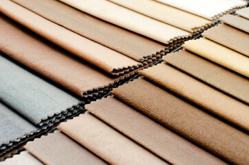 catalog of interior luxury fabric sample chart showing texture of fabric in pastel beige color tone. interior drapery and curtain samples palette.