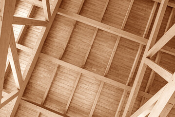 Wooden roof construction. Part of the floor of a wooden house.