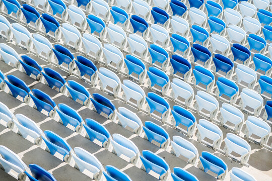 Empty Seats In A Football Stadium In Sunlight