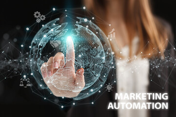 Business, Technology, Internet and network concept. Young businessman working on a virtual screen of the future and sees the inscription: Marketing automation